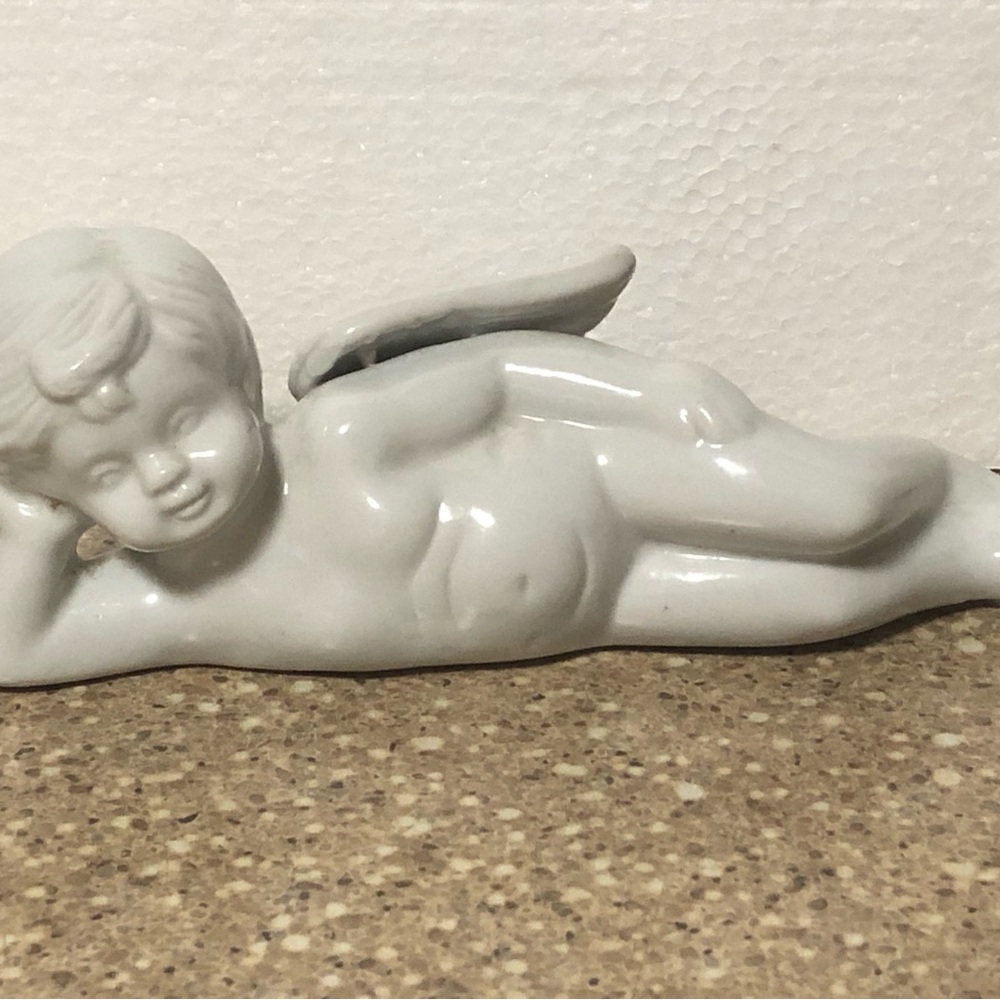 White Porcelain Laying Down Cherub/Angel Figure